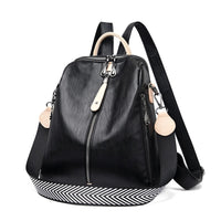 Sac à dos simili cuir femme noir avec poignée blanche